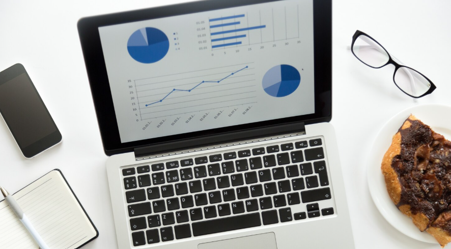 Laptop displaying charts and summary statistics