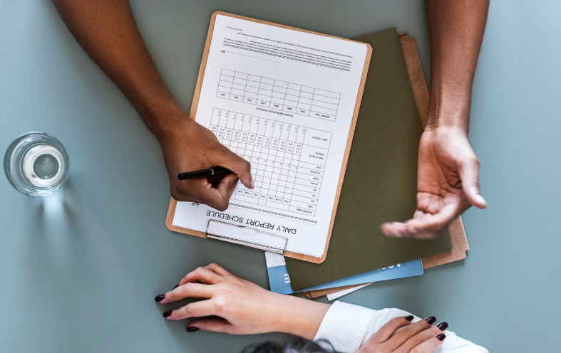 Researcher reviewing a questionnaire on a clipboard