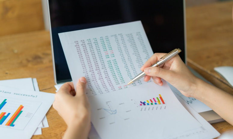 Researcher reviewing numerical data and charts